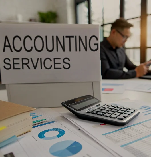 Professional-Accounting-Services-Office-Workspace Accounting services setup with calculator and financial charts on desk